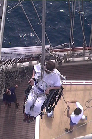 Top angle of Gene being lowered using a block and tackle system