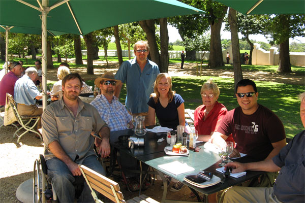 Gene and friends dining outside in the sunshine