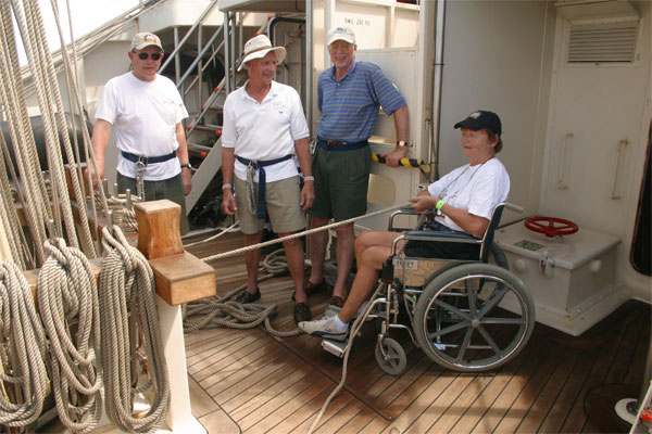 The happy crew on board the sail boat.