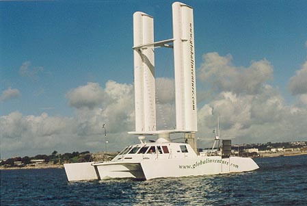 A large ship with a wheelchair lift in a body of water 