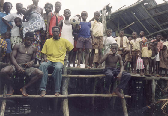 Villagers in Ghana pose for the camera