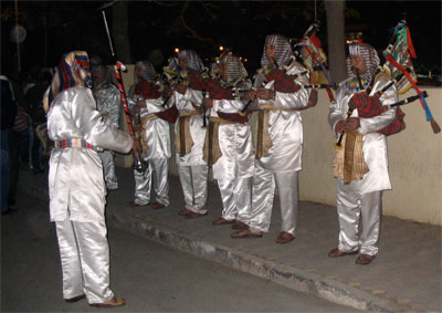 group of Egyptian musicians  playing bagpipes.