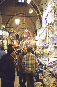 A group of people standing in front of a store