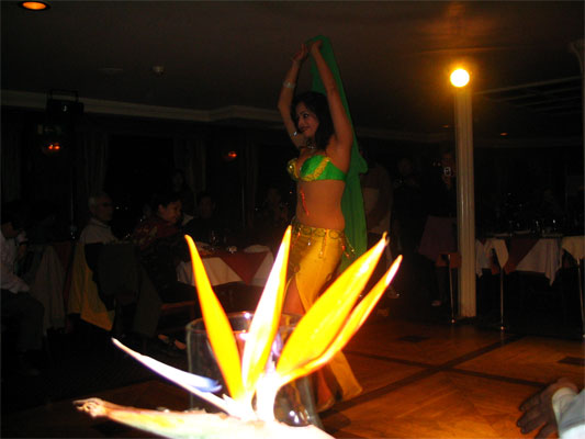 A woman belly dancing inside of a cruise on the Nile river in Egypt.