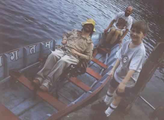 Gene and two other men sitting in a boat