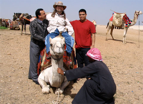 Gene with two friends and a camel in Cairo, Egypt.