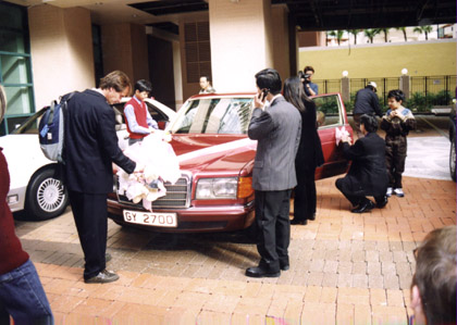 Gene and friends prepare Cheung's car for his wedding departure 