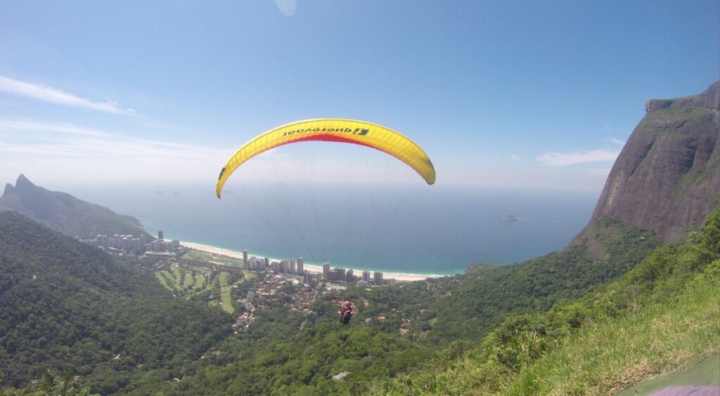 Gene flying through the air on a grassy hill