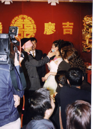 Cheung and his wife Cindy play games at their wedding in Hong Kong