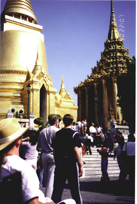 A group of people standing in front of a palace in Thailand