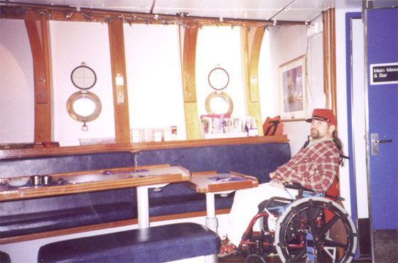 Gene posing in front of a table in the mess