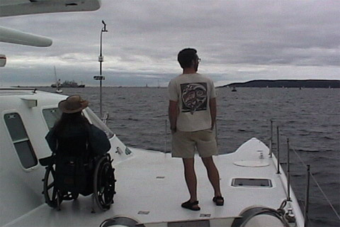 Gene and Michael in the middle of the ship looking at the ocean