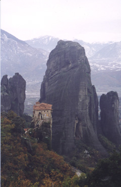 A view of a rocky mountain with Meteora in the background