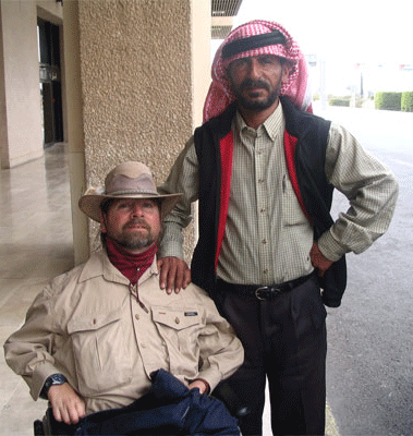 Gene and Mohamed pose for a photo