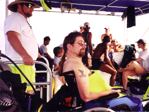 A group of people sitting on a motorcycle