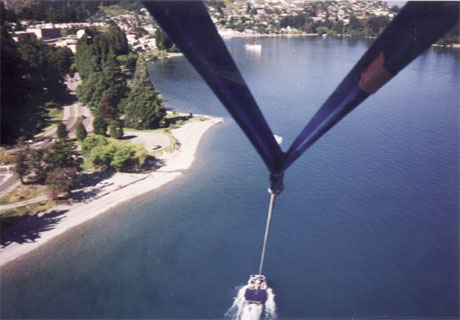 View from above in a parasail looking down at the boat
