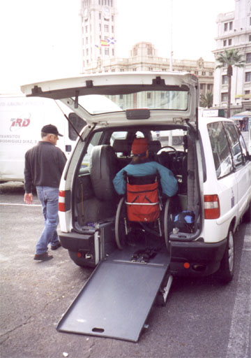 gene getting inside thr back of a van through an accessible ramp