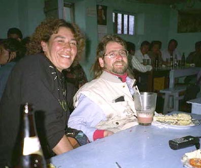 Gene and tour guide, Rosa smiling at a restaurant table