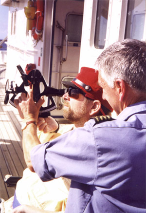 Ship captain showing gene how to use a sextant