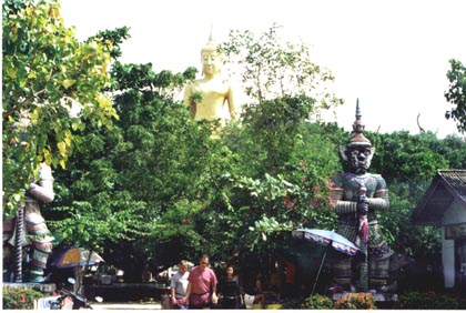 Large Buddha shine in the jungle of Thailand