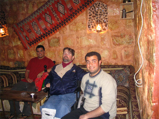 Gene and friends in a hotel spa room in Jordan