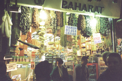 A person standing in front of a bazaar in Turkey