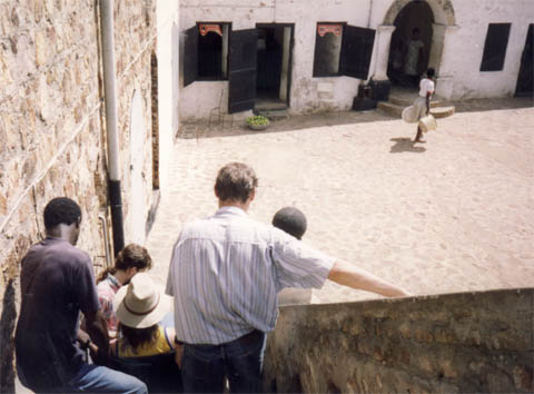 Gene being carried down the steps within the fort