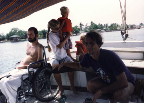 Gene with friends and family on a boat in Ghana.