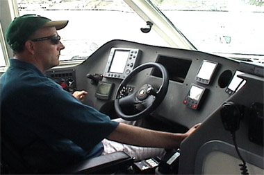 Trevor on the ship's helm