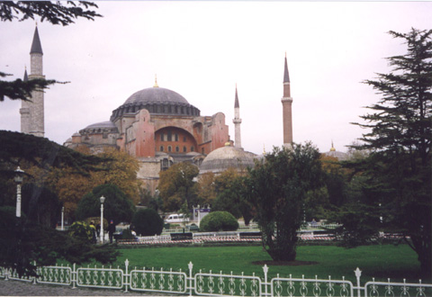 Image of Hagia Sophia, a renowned cathedral turned into a mosque with a large flat dome on top