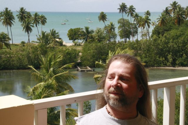 Gene enjoying the sunshine in Puerto Rico on a balcony.