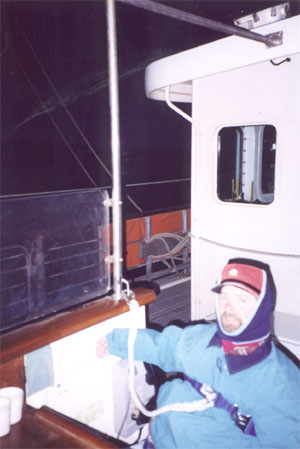Gene on the ship deck with a safety strap on