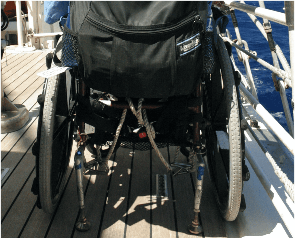 Gene's wheel chair seen from the back portion of the chair.