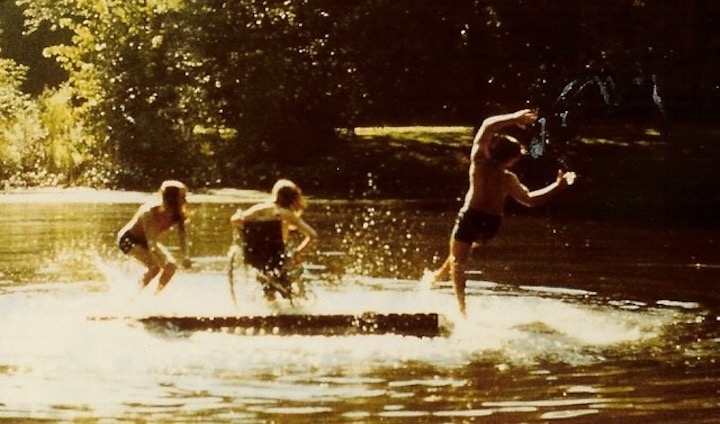 Three children playing in water