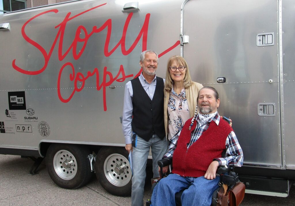 Gene poses in front of the Story Corp van with Joni Rogers and her husband.