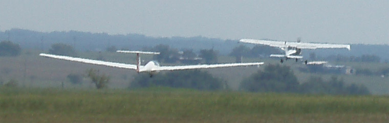 Two planes take off in the sky