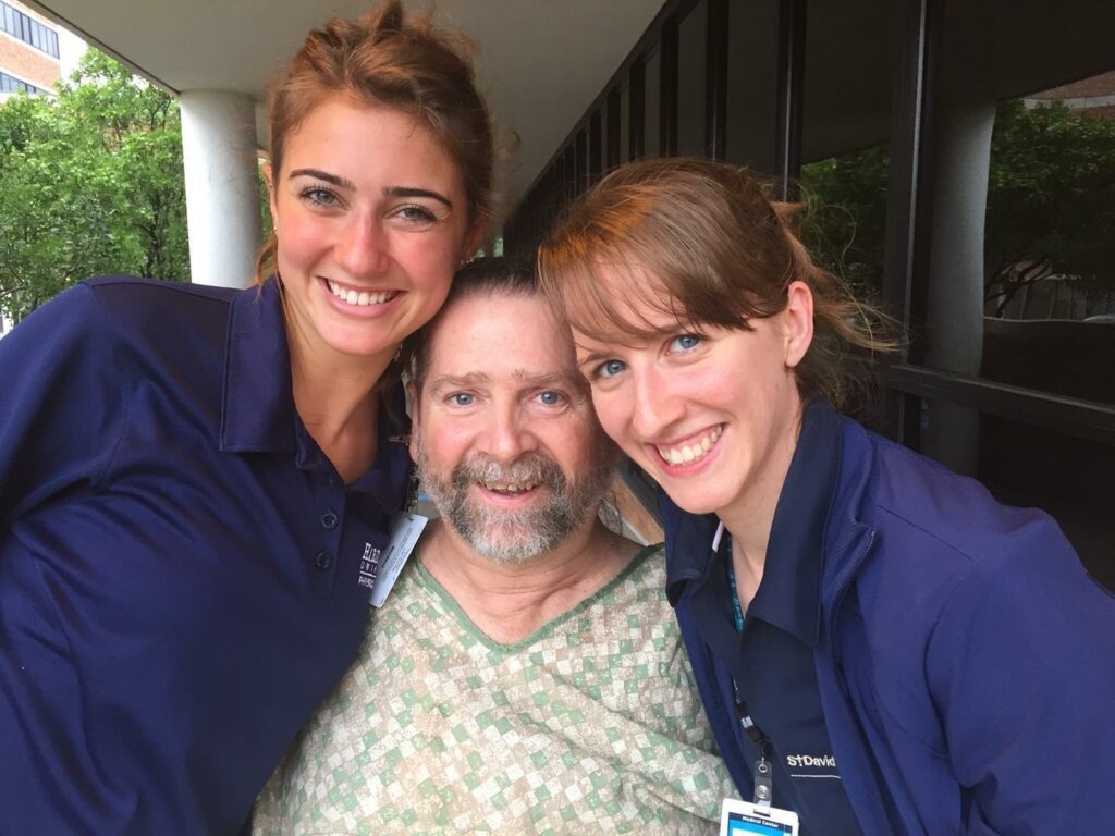 Gene poses between 2 physical therapists