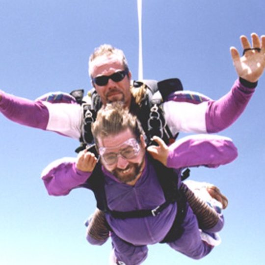 Gene is sky diving with an instructor