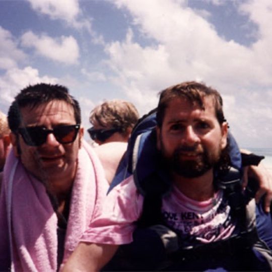 Gene with his brother on a dinghy.